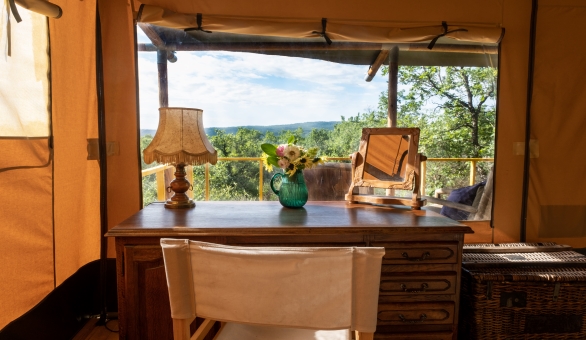 The valley view from en-suite safari tent Samburu. With vintage wood desk and vintage items.