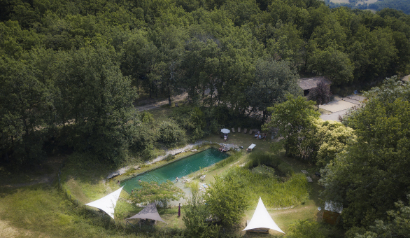 Aerial photograph for Le Camp's natural swimming pool which has featured in The Guardian Travel.